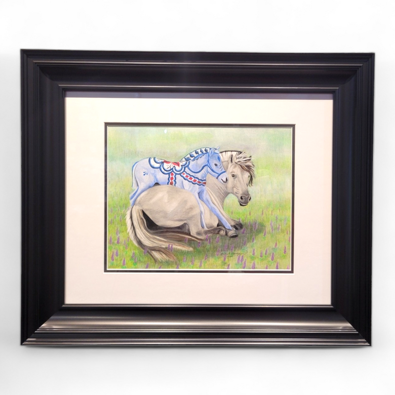 Framed painting titled "Fjord Foal Dala Horse" measuring 25x21, featuring a reclining Norwegian Fjord Horse adorned with artistic blue markings against a grassy background.