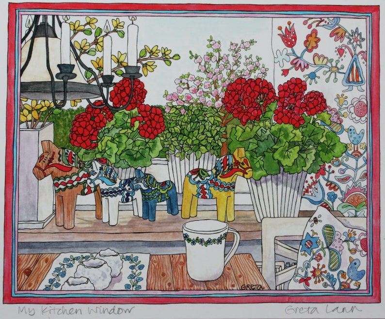 A vibrant illustration titled "My Kitchen Window" by Greta Lann depicts a Swedish windowsill adorned with potted geraniums, decorative Dalahorses, a patterned pillow, and a cup on a wooden surface, highlighting the striking red and pink flowers.